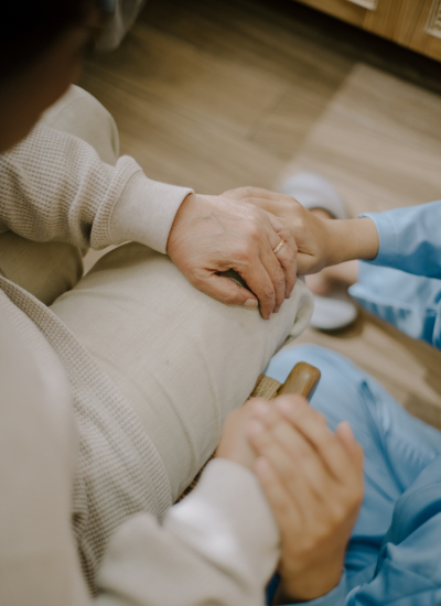 Compassionate nurse treating a patient at home